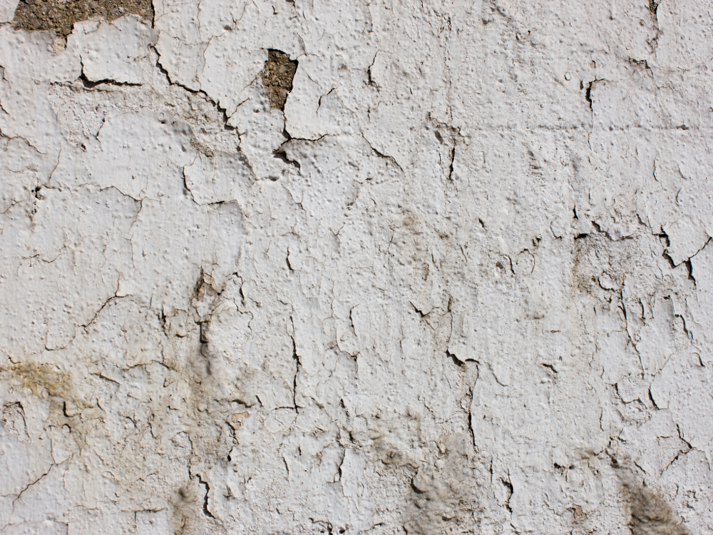 Cracked paint on exterior wall